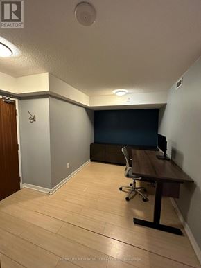 Toronto (Waterfront Communities) condo for rent - A room with a desk and a computer.