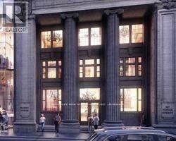 Toronto (Church-Yonge Corridor) condo for rent - A building with a large front entrance and a row of pillars.
