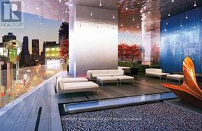 Toronto (Church-Yonge Corridor) condo for rent - A modern living room with a cityscape view.