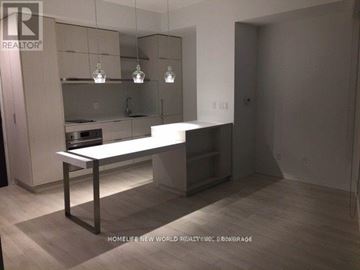 Toronto (Church-Yonge Corridor) condo for rent - A modern kitchen with a white countertop and a bar stool.