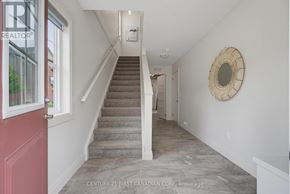 London North (North I) townhouse for rent - A hallway with a staircase leading to the second floor.