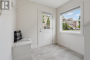 London North (North I) townhouse for rent - A room with a window showing a view of a residential area.