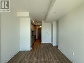 Toronto (Banbury-Don Mills) condo for rent - A long hallway with wood floors and white walls.