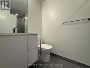 Toronto (Banbury-Don Mills) condo for rent - A white toilet sits in a small, white bathroom.