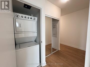 Mississauga (City Centre) condo for rent - A white oven and stove top are in a kitchen area.