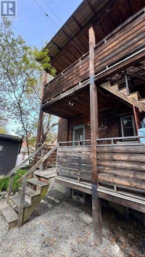 Sudbury apartment for rent - A wooden deck with a staircase leading to a balcony.