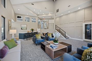 Charlotte apartment for rent - A living room with a white couch and a coffee table.