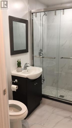 Toronto (Rockcliffe-Smythe) townhouse for rent - A bathroom with a sink, toilet and shower.
