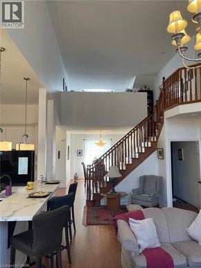 Hamilton apartment for rent - A well-lit, spacious living room with a staircase leading to the upper floor.