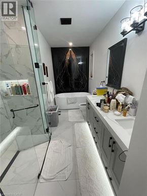 Hamilton apartment for rent - A bathroom with a glass shower stall and a white counter.