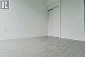 Toronto (Church-Yonge Corridor) condo for rent - A room with a white door and a wooden floor.