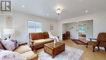 Newmarket (Central Newmarket) apartment for rent - A living room with a brown leather couch and a wooden coffee table.