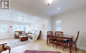 Newmarket (Central Newmarket) apartment for rent - A living room with a couch, chairs, and a dining table.