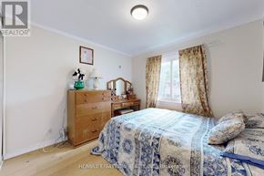 Newmarket (Central Newmarket) apartment for rent - A bedroom with a bed, dresser, and window.