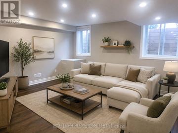 Milton (Cb Cobban) apartment for rent - A living room with a white couch and a coffee table.