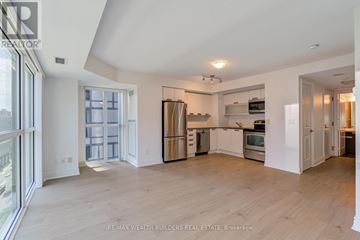 Toronto (Church-Yonge Corridor) condo for rent - A spacious kitchen with white cabinets and stainless steel appliances.