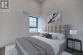 Hamilton (Beasley) condo for rent - A bedroom with a large bed and a painting on the wall.