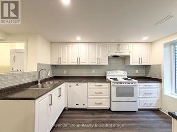 Toronto (Pleasant View) apartment for rent - A kitchen with white cabinets and a black countertop.