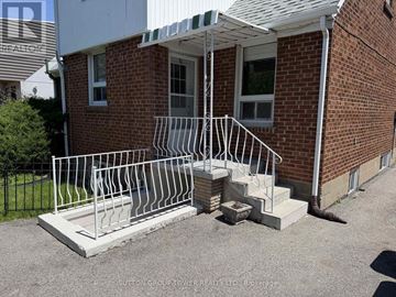 Toronto (Yorkdale-Glen Park) apartment for rent - A white kitchen with a refrigerator on the right.