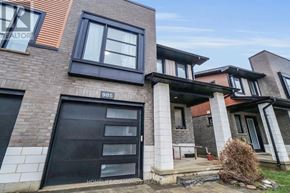 London North (North M) townhouse for rent - A modern house with a black door and windows.
