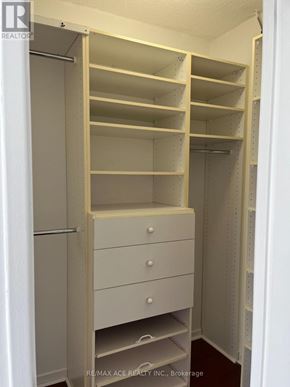 Toronto (Newtonbrook West) condo for rent - A white closet with shelves and drawers is shown.