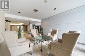 Toronto (Guildwood) condo for rent - A living room with beige chairs and a glass table.