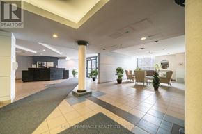 Toronto (Guildwood) condo for rent - A spacious lobby with a reception desk and seating area.