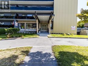 Toronto (Wexford-Maryvale) multi-family for rent - A building with a sign that says "REALTOR" on the top floor.