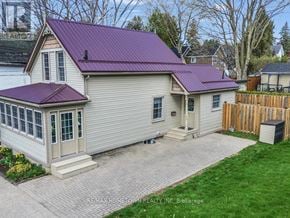 Brockville apartment for rent - A house with a purple roof is for sale in Brokage.