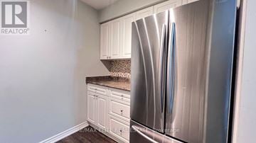 Aurora (Aurora Village) townhouse for rent - A kitchen with a stainless steel refrigerator and white cabinets.