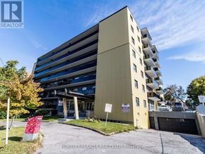 Toronto (Wexford-Maryvale) multi-family for rent - A multi-story building with a sign that reads "HOMELIFE/MIRACLE REALTY LTD, Brokerage" in front of it.