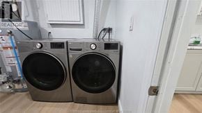 Windsor apartment for rent - Two front load washing machines are placed next to each other.