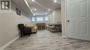 Windsor apartment for rent - A living room with a couch, chair, and rug.