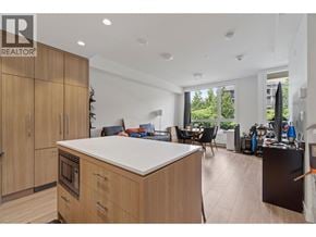 Burnaby apartment for rent - A modern kitchen with wooden cabinets and a large island.