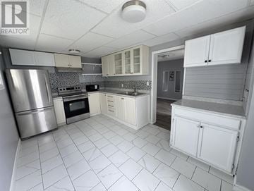 Sault Ste. Marie apartment for rent - A kitchen with white cabinets and appliances.