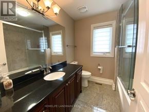 Toronto (Agincourt South-Malvern West) apartment for rent - A bathroom with a sink, toilet, and bathtub.