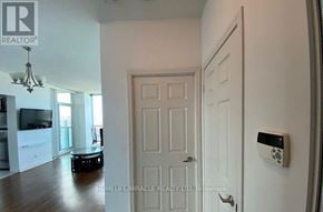 Mississauga (City Centre) house for rent - A white door with a security system on the wall.