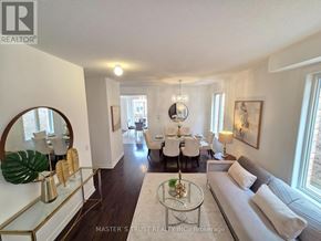 Markham (Wismer) apartment for rent - A well-lit, spacious living room with a dining area in the background.
