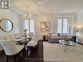 Markham (Wismer) apartment for rent - A well-lit, spacious dining room with a glass table and chairs.