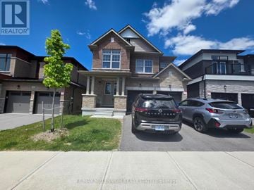 Springwater (Midhurst) apartment for rent - A house with a car and another car parked in front.