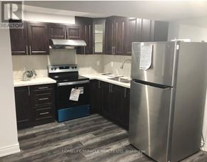 Mississauga (Meadowvale Village) apartment for rent - A kitchen with a refrigerator, stove, and sink.
