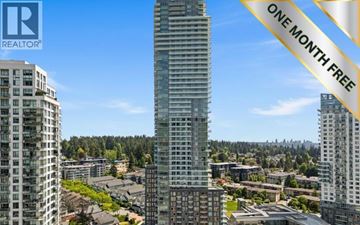 Coquitlam apartment for rent - A tall building with the words "ONE MONTH FREE" on a banner in the foreground.
