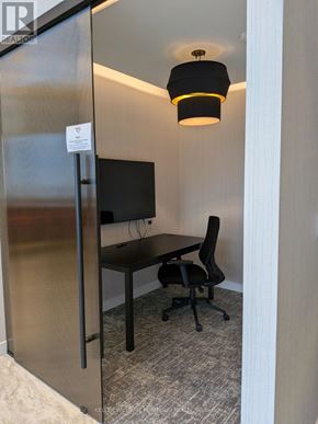 Toronto (York University Heights) condo for rent - A small room with a desk and a chair.
