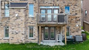 Mono apartment for rent - A brick building with a balcony and a sign that says "INDEX REALTY BROKERAGE INC."
