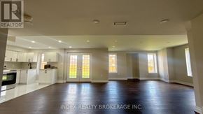 Mono apartment for rent - A spacious living room with a kitchen in the background and a large window on the wall.