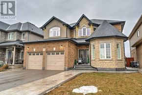Hamilton (Stoney Creek) apartment for rent - A large, well-maintained house with a driveway and garage.