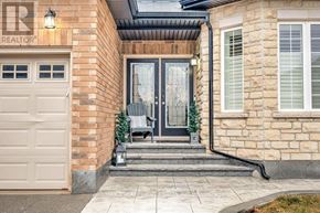 Hamilton (Stoney Creek) apartment for rent - A house with a realtor sign on the wall.