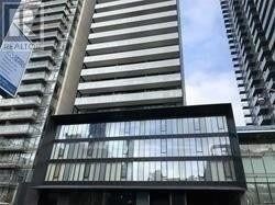 Toronto (Church-Yonge Corridor) condo for rent - A building with a balcony in front of two other buildings.
