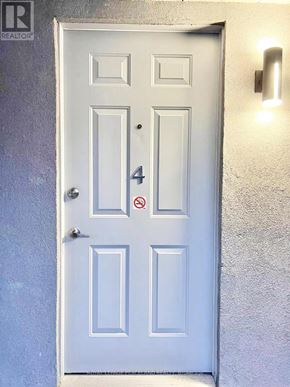 Niagara Falls (Cherrywood) multi-family for rent - A white door with a number 4 on it.