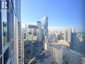 Toronto (Bay Street Corridor) condo for rent - A cityscape viewed from a high-rise building with the words "LYF REALTY, Brokerage" visible.